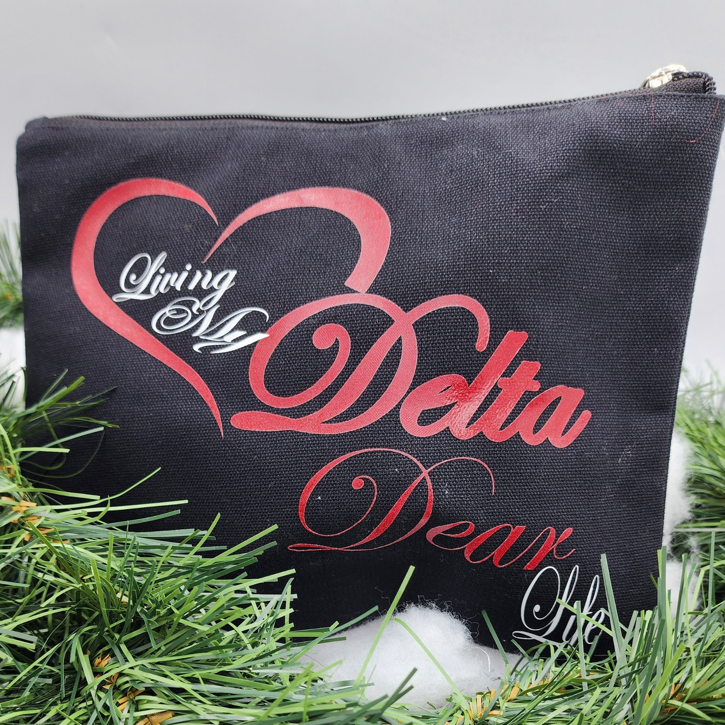 A Travel Bag/Organizer Saying "Living My Delta Dear Life"