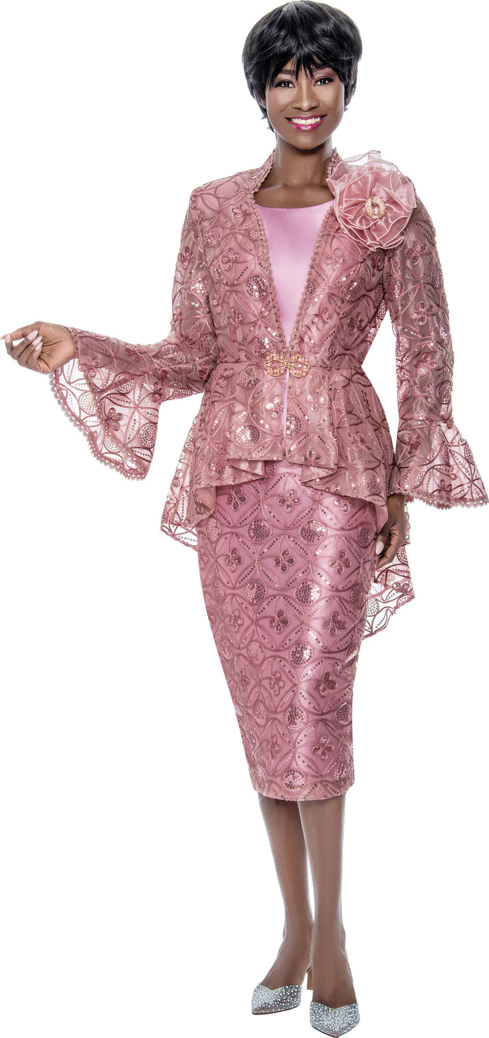 A woman wearing a mauve 3-piece lace suit with a peplum jacket, tank top, and skirt.