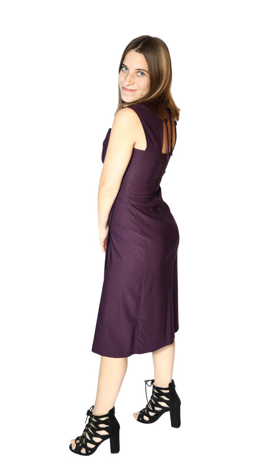 Woman wearing a purple dress on a white background