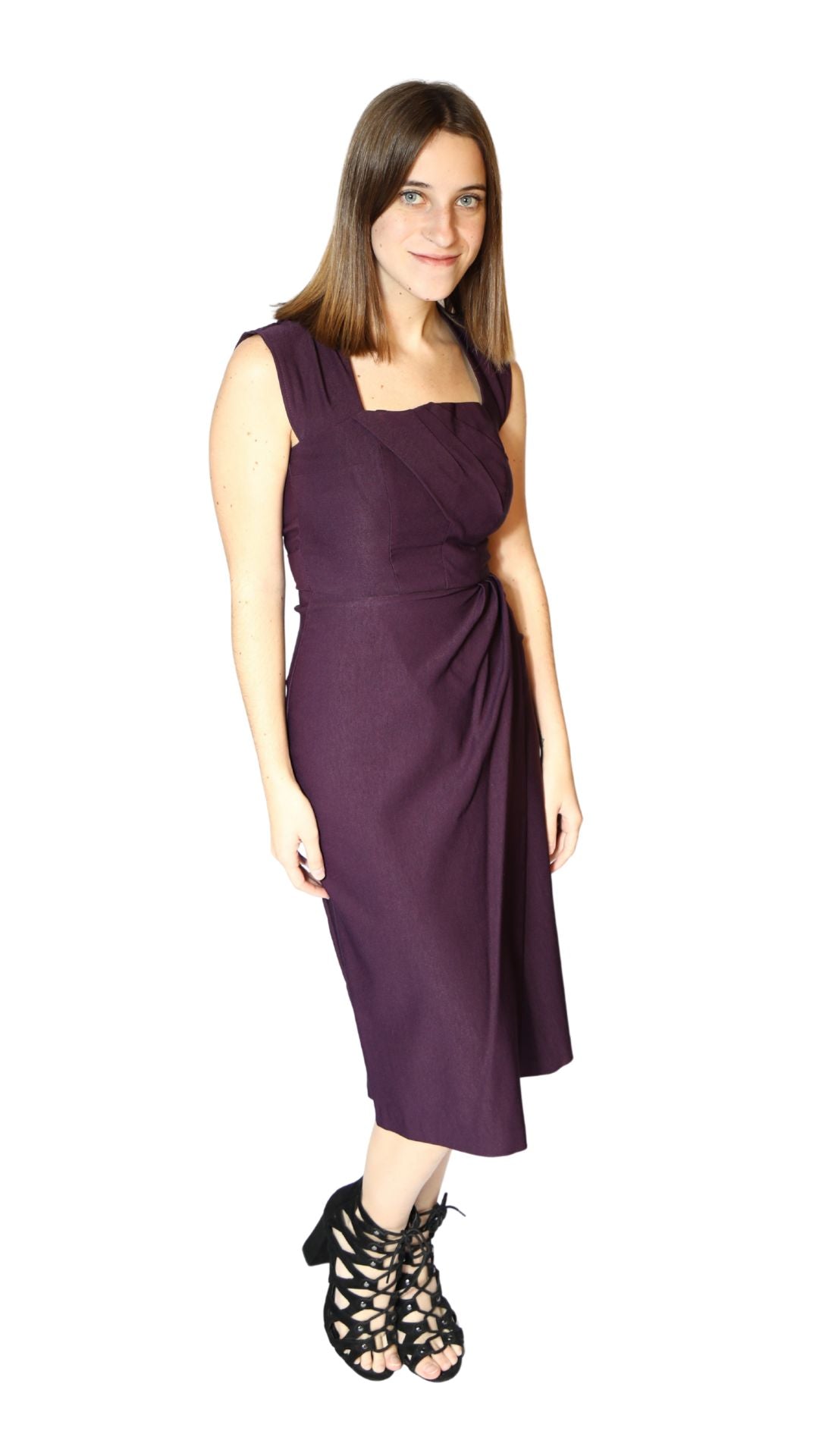 Woman wearing a purple dress on a white background