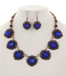 Jewelry set with blue gemstones and gold accents