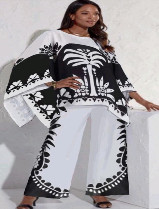 Woman wearing a black and white patterned outfit on a white background