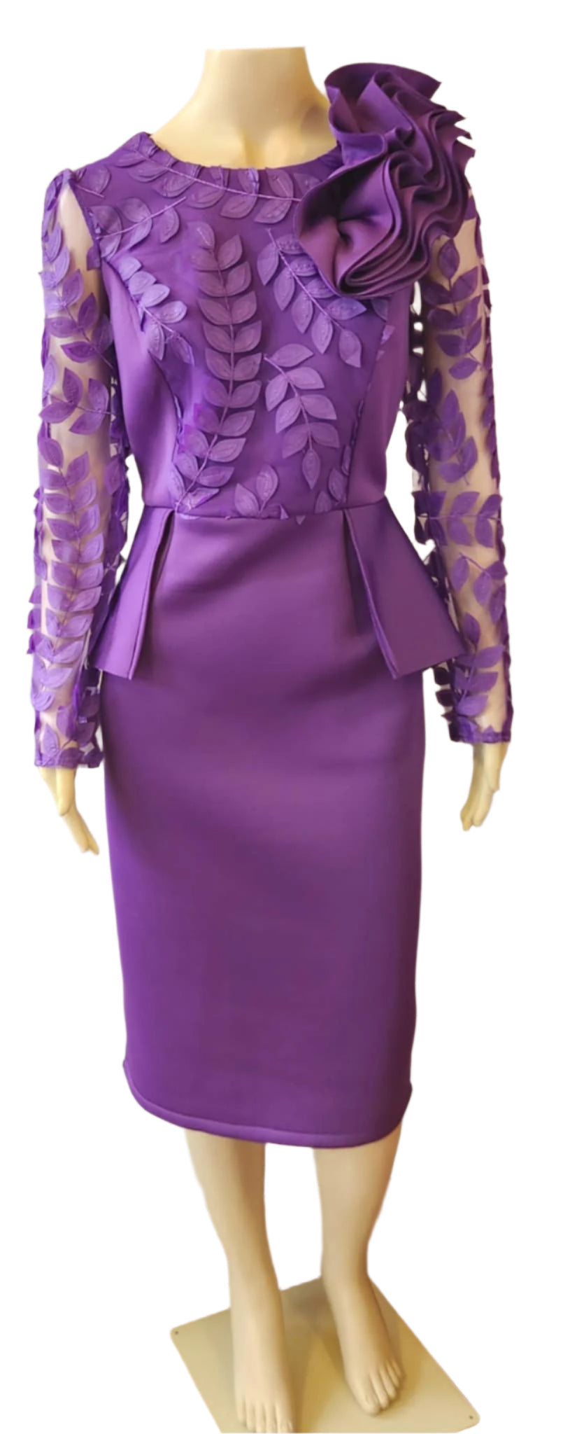 Purple dress with intricate detailing on a mannequin against a white background