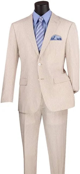 Beige pinstripe suit with a blue shirt and striped tie on a mannequin against a white background