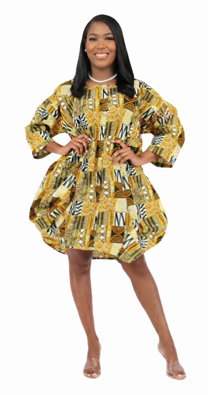 Woman wearing a yellow and black patterned dress on a white background