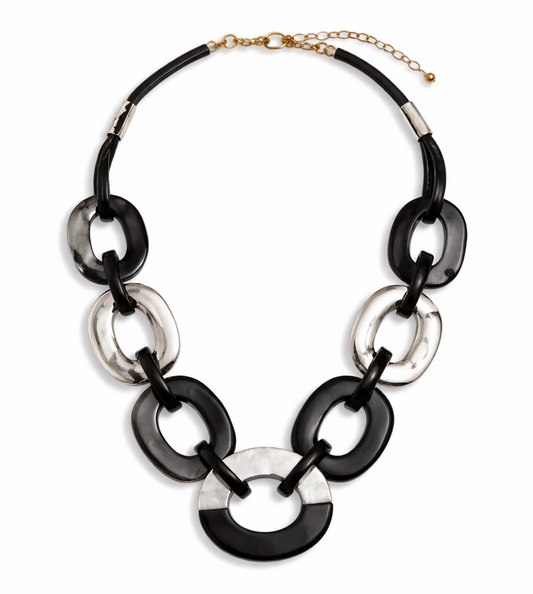 Necklace with black and silver circular links on a white background