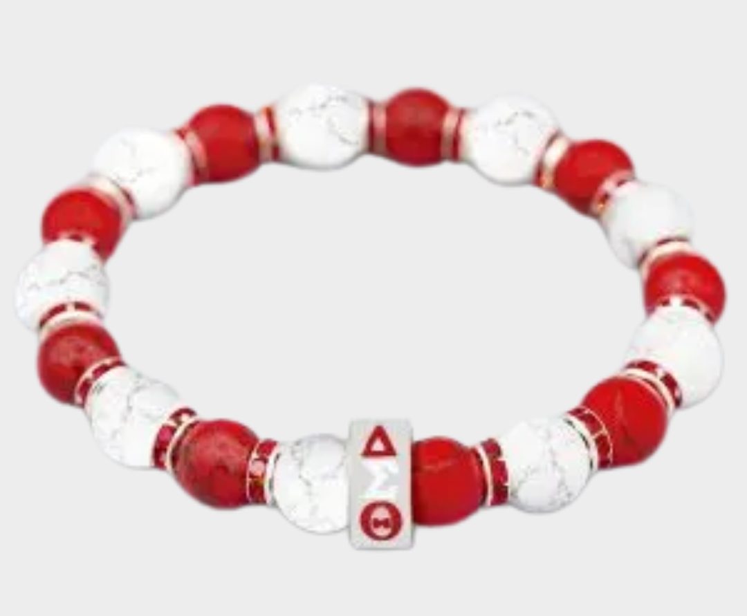 Red and white beaded bracelet with a Delta Sigma Theta in greek letters on it on a white background