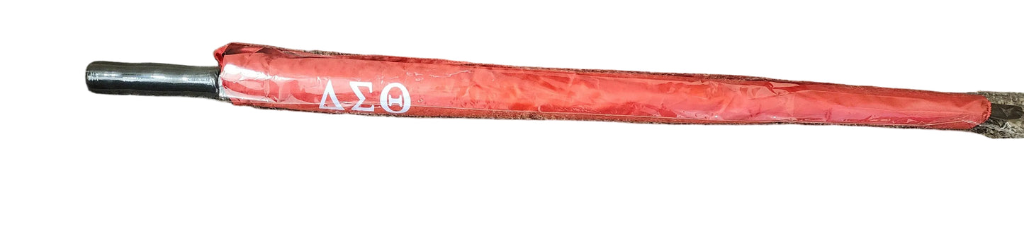 Red umbrella with a black handle on a white background