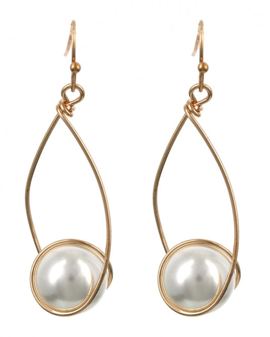 Gold-framed earrings with white pearls on a white background