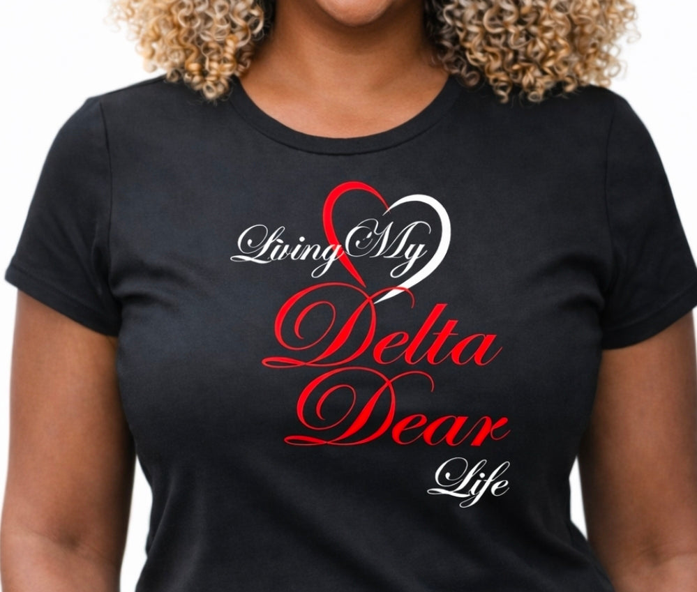 Black t-shirt with 'Living My Delta Dear Life' text and heart design worn by a person.