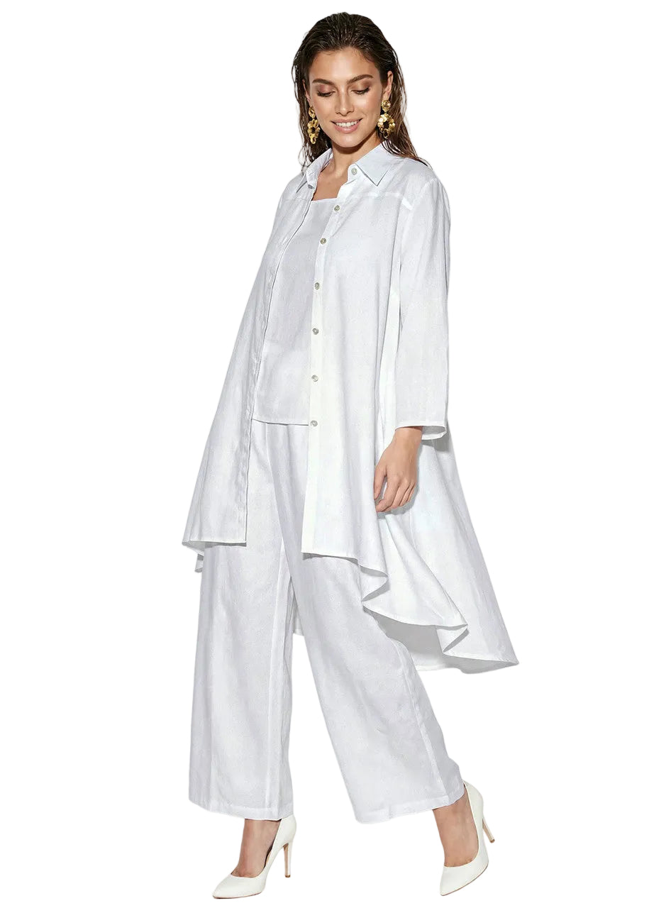 Woman wearing an elegant white three-piece palazzo pant set with flowing duster jacket.