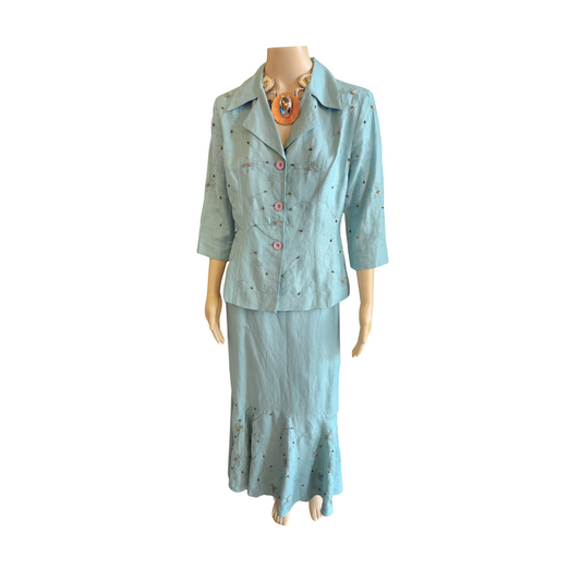 Light blue dress set on a mannequin against a white background