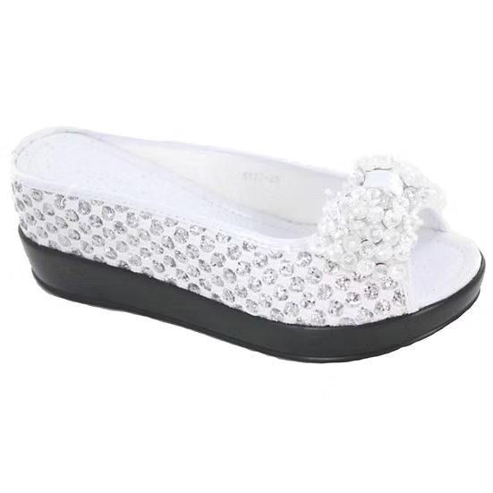 White sandal with rhinestone embellishments on a white background
