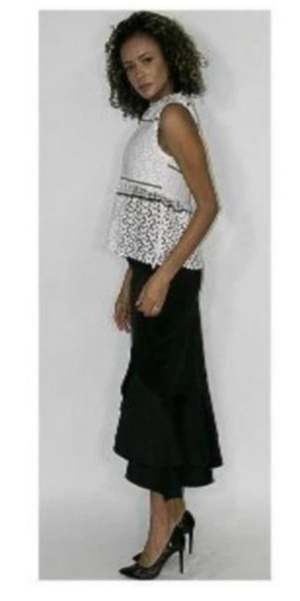white sleeveless top with black accents and lace bottom