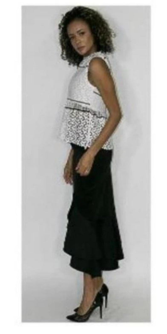 white sleeveless top with black accents and lace bottom